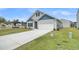Beautiful home with a wide driveway, two-car garage, and manicured lawn at 309 Torslanda Ln, Summerville, SC 29486