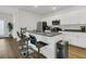Contemporary kitchen featuring granite countertops, a breakfast bar, white cabinets, and stainless appliances at 309 Torslanda Ln, Summerville, SC 29486