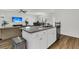 Open-concept kitchen featuring a granite island and stainless steel appliances at 309 Torslanda Ln, Summerville, SC 29486
