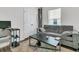 Cozy living room with modern gray sofa, accent rug, and nearby natural light exposure at 309 Torslanda Ln, Summerville, SC 29486