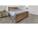 Comfortable bedroom featuring a wooden bed frame and matching nightstands at 309 Torslanda Ln, Summerville, SC 29486