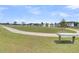 Community park offers a green space with walking path and park benches at 309 Torslanda Ln, Summerville, SC 29486