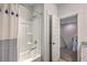 Bathroom with a shower-tub combination featuring a shower curtain and an open doorway to the hallway at 3119 Sturbridge Rd, Mount Pleasant, SC 29466