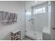 Bright bathroom featuring a glass-enclosed shower with white subway tile and a marble-topped storage cart at 3119 Sturbridge Rd, Mount Pleasant, SC 29466