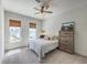 Cozy bedroom with natural light, a ceiling fan, and a wooden dresser, creating a relaxing atmosphere at 3119 Sturbridge Rd, Mount Pleasant, SC 29466