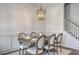 Elegant dining room featuring stylish wallpaper, modern lighting, and a well-appointed table setting at 3119 Sturbridge Rd, Mount Pleasant, SC 29466