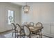 Elegant dining room featuring stylish wallpaper, modern lighting, and a well-appointed table setting at 3119 Sturbridge Rd, Mount Pleasant, SC 29466