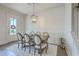 Elegant dining room featuring stylish wallpaper, modern lighting, and a well-appointed table setting at 3119 Sturbridge Rd, Mount Pleasant, SC 29466