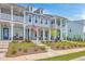 Charming townhomes boast double porches, inviting curb appeal, and classic architectural details at 3119 Sturbridge Rd, Mount Pleasant, SC 29466