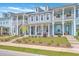 Charming townhomes boast double porches, inviting curb appeal, and classic architectural details at 3119 Sturbridge Rd, Mount Pleasant, SC 29466