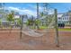 Relaxing hammock area in a townhouse community surrounded by trees on a sunny day at 3119 Sturbridge Rd, Mount Pleasant, SC 29466