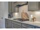 Gourmet kitchen showcasing stainless steel appliances, quartz countertops, and designer backsplash at 3119 Sturbridge Rd, Mount Pleasant, SC 29466