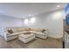 Inviting living room with a comfortable sectional sofa, ottoman, and a TV, creating a relaxing space at 3119 Sturbridge Rd, Mount Pleasant, SC 29466