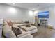 Cozy living room with a large sectional sofa, ottoman, and a TV, perfect for relaxing and entertaining at 3119 Sturbridge Rd, Mount Pleasant, SC 29466