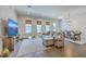 Spacious living room flows into dining area, featuring modern furnishings and natural light at 3119 Sturbridge Rd, Mount Pleasant, SC 29466
