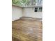 Spacious wooden deck offers outdoor living with a door entry and natural light from the upper windows at 334 E Poplar Branch Dr, Moncks Corner, SC 29461