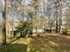 Spacious backyard surrounded by tall trees, offering privacy and a natural setting at 334 E Poplar Branch Dr, Moncks Corner, SC 29461