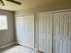 Bedroom featuring tile floors and closet doors at 334 E Poplar Branch Dr, Moncks Corner, SC 29461