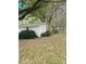 Exterior of detached garage with a small window surrounded by nature at 334 E Poplar Branch Dr, Moncks Corner, SC 29461