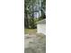 Detached garage with a concrete driveway surrounded by trees at 334 E Poplar Branch Dr, Moncks Corner, SC 29461