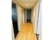 Hallway featuring wood floors and white trim at 334 E Poplar Branch Dr, Moncks Corner, SC 29461