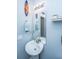Bathroom featuring a pedestal sink, decorative mirror and lighting, and a surfboard wall decoration at 3363 Kinross Ct, Summerville, SC 29485