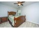 Cozy bedroom with carpet, wood furniture, ceiling fan, and bright light from the window at 3363 Kinross Ct, Summerville, SC 29485