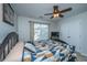 Bedroom with a decorative bed, carpeted floors, window, and modern ceiling fan at 3363 Kinross Ct, Summerville, SC 29485