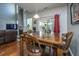 Cozy dining area with hardwood flooring, natural light and adjacent living area at 3363 Kinross Ct, Summerville, SC 29485