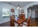 Bright dining room with hardwood floors, decorative accents, and plenty of natural light at 3363 Kinross Ct, Summerville, SC 29485