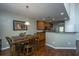 Dining area with hardwood flooring, chandelier and painting at 3363 Kinross Ct, Summerville, SC 29485