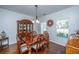 Elegant dining room featuring hardwood floors, a classic chandelier, and ample natural light at 3363 Kinross Ct, Summerville, SC 29485