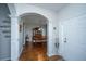 Inviting foyer with hardwood floors, decorative columns, and an open view to the dining room at 3363 Kinross Ct, Summerville, SC 29485