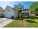 Charming two-story home with a well-manicured lawn and a two car garage at 3363 Kinross Ct, Summerville, SC 29485