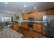 Kitchen with wood cabinets, granite countertops, and stainless-steel appliances at 3363 Kinross Ct, Summerville, SC 29485
