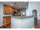 Well-lit kitchen with granite countertops, stainless-steel appliances, and wood cabinets at 3363 Kinross Ct, Summerville, SC 29485