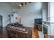 Spacious living room with high ceilings, fireplace, and comfortable leather seating and hardwood flooring at 3363 Kinross Ct, Summerville, SC 29485