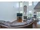 Bright living room with high ceilings, a fireplace, and large windows for plenty of natural light at 3363 Kinross Ct, Summerville, SC 29485