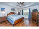 Cozy main bedroom with a wooden bed frame, tray ceilings and natural light from the window at 3363 Kinross Ct, Summerville, SC 29485