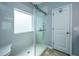 Modern shower with a glass enclosure, tiled walls, built-in seat, and a handheld shower head at 3363 Kinross Ct, Summerville, SC 29485