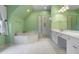 Well-lit bathroom with a glass-enclosed shower, soaking tub, and double sink vanity at 345 Mentor Rd, Summerville, SC 29483