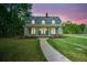 Inviting home with a covered porch and a walkway leading to the entrance at 345 Mentor Rd, Summerville, SC 29483
