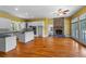 Spacious kitchen with white cabinetry, granite countertops, hardwood floors, and stainless steel appliances at 345 Mentor Rd, Summerville, SC 29483