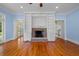 Spacious living room with hardwood floors and a brick fireplace with built-in bookshelves at 345 Mentor Rd, Summerville, SC 29483