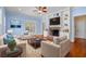 Cozy living room with a brick fireplace, built-in bookshelves, and comfortable seating at 345 Mentor Rd, Summerville, SC 29483