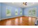 Bright, empty living room with hardwood floors, natural light, and glass doors leading to outdoors at 345 Mentor Rd, Summerville, SC 29483
