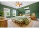 Cozy main bedroom with sloped ceilings, a ceiling fan, and a plush, patterned rug at 345 Mentor Rd, Summerville, SC 29483