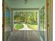 Inviting view of the home's property from the front porch, showing a tree-lined yard at 345 Mentor Rd, Summerville, SC 29483