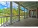 Spacious outdoor balcony featuring wood floors and a view of the surrounding greenery at 349 Mentor Rd, Summerville, SC 29483
