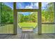Charming balcony with a view of a lush green lawn surrounded by mature trees at 349 Mentor Rd, Summerville, SC 29483